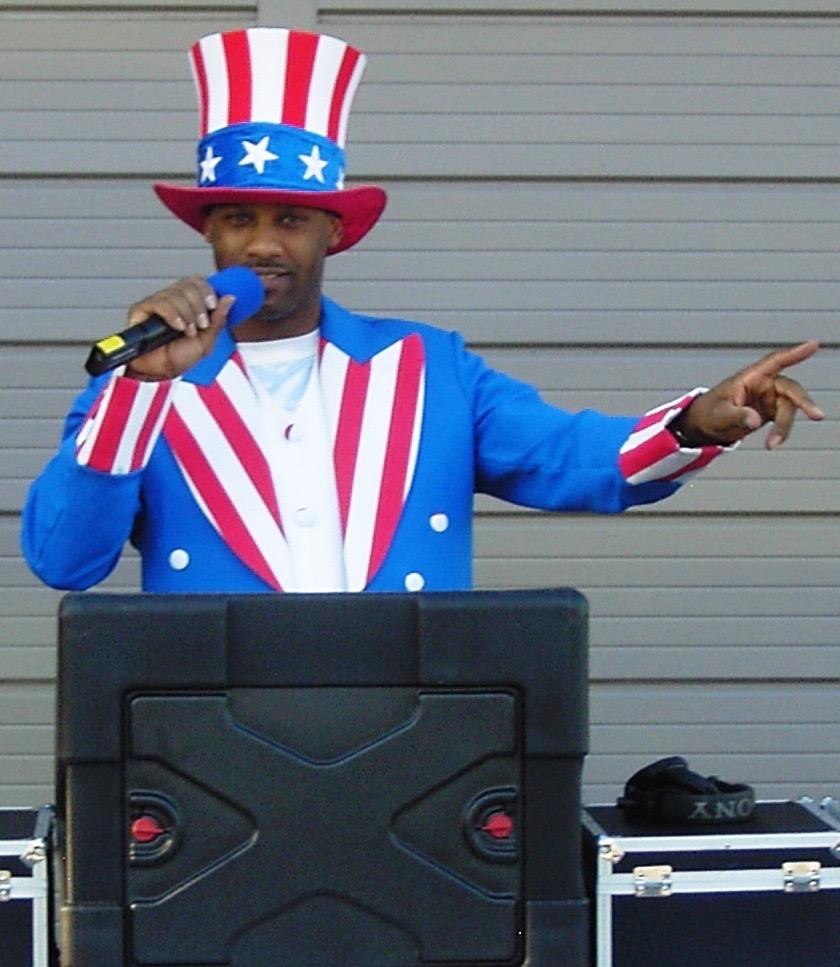 MC in a patriotic Uncle Sam costume at a holiday event